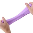 Hands stretching purple slime toy