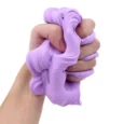 Hand squeezing purple slime toy