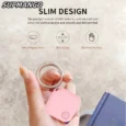 Slim pink keychain in hand, modern design.